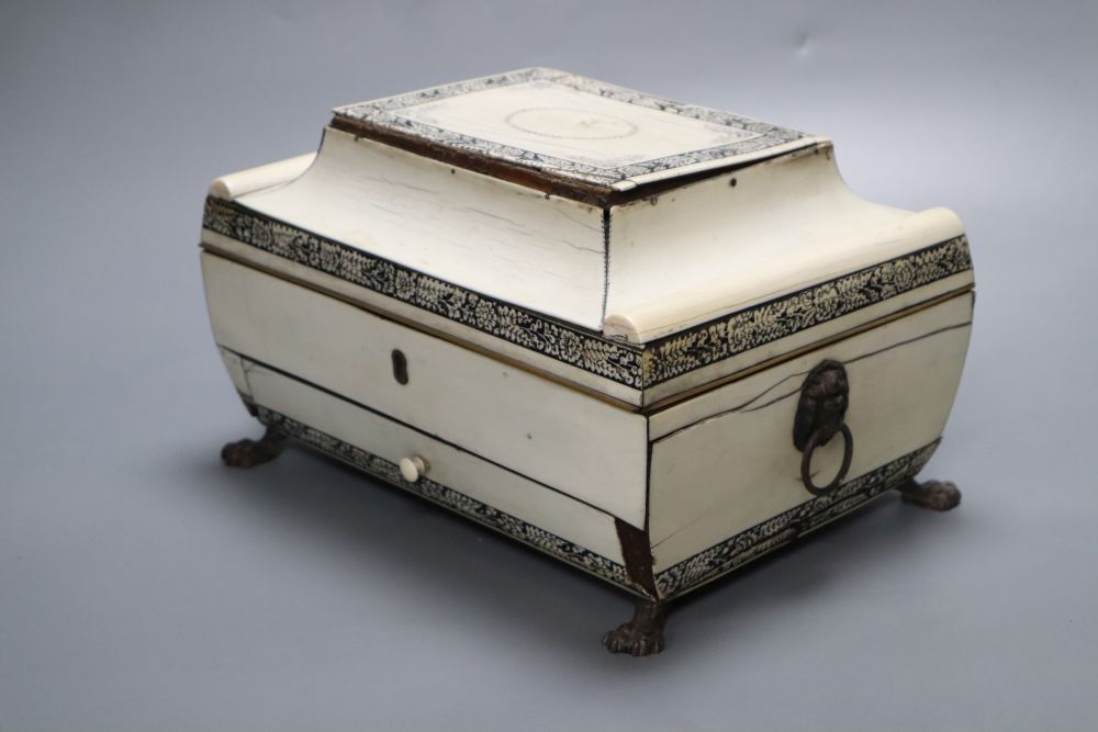 An early 19th century Anglo-Indian Vizagapatam dressing table box, of sarcophagus form, with lion paw feet, width 27cm